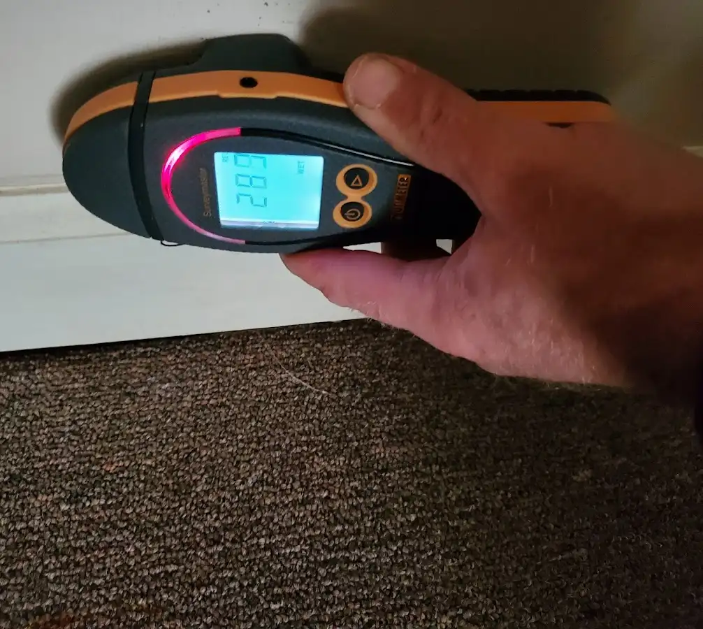 Moisture detection at baseboard during Storm Damage Restoration in Ormond-by-the-Sea